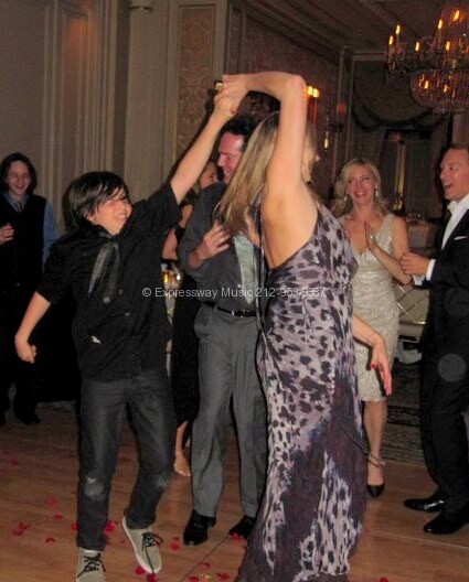 wedding guests having fun on dance floor Essex house nyc