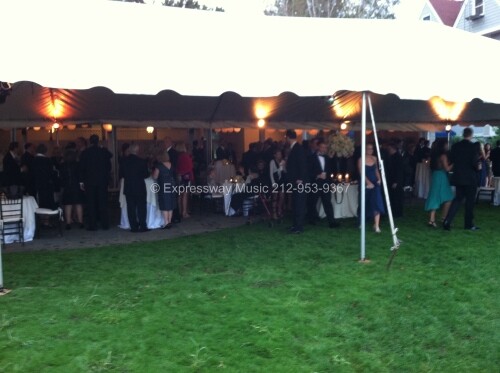 Guests enjoy Cocktail hour under tent at Larchmont Yacht Club Wedding