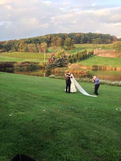 Bride, Groom and Photographer on Winery grounds