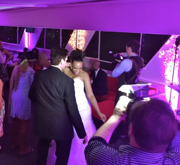 Groom and Bride dancing on affinity yacht