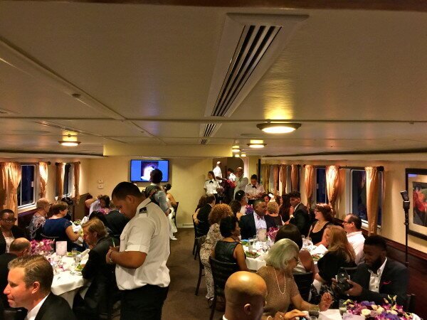 wedding guests having dinner on affinity Yacht