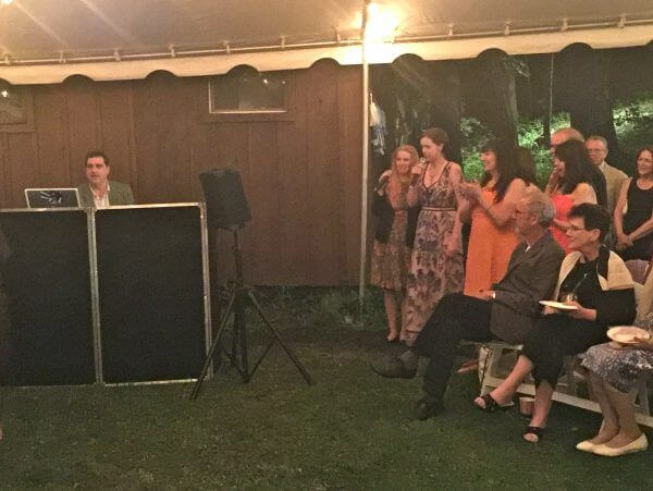 Bride and Bridesmaids singing Karaoke under tent