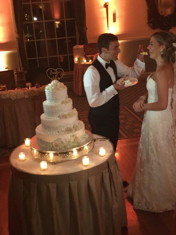 Groom feeds Bride Wedding Cake