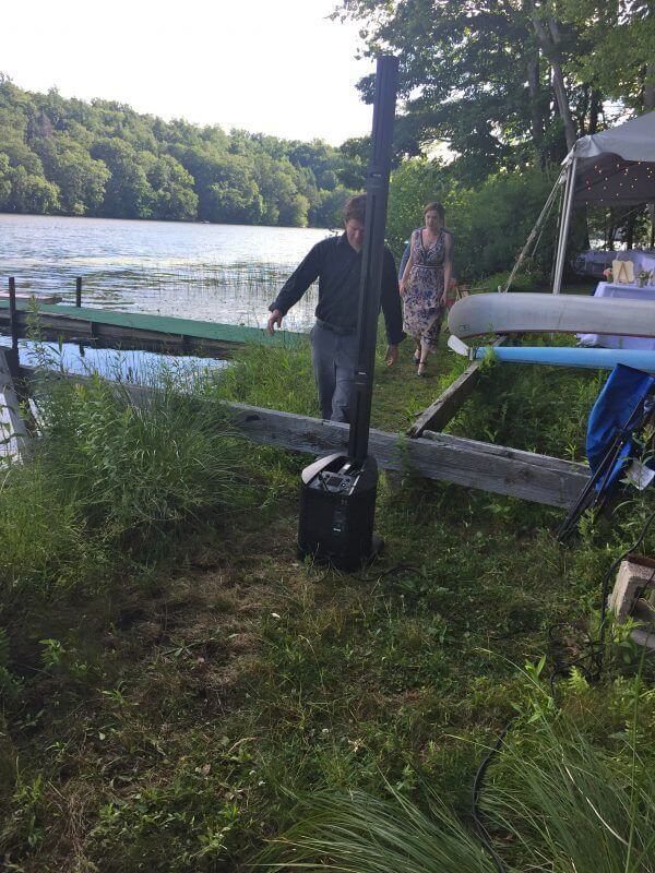 Expressway Music Bose speaker facing wedding guests in dinner tent in south salem lakefront ny