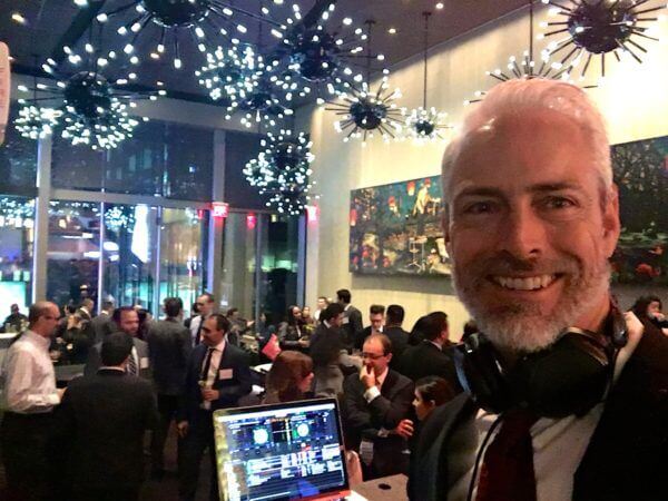 close up of dj greg at holiday event for ernst & young