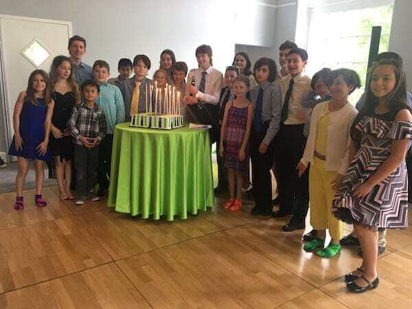 Bar Mitzvah Boy's Friends lighting candle