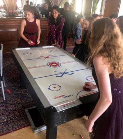 Bat Mitzvah guests playing Air Hockey