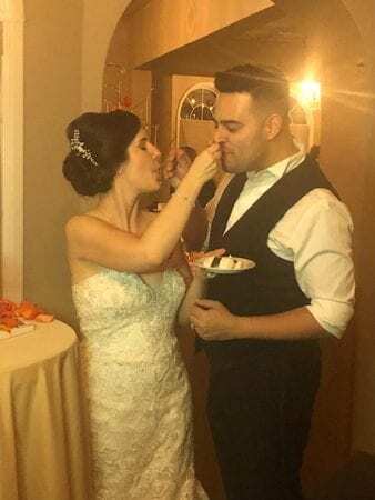 bride feeds cake to groom
