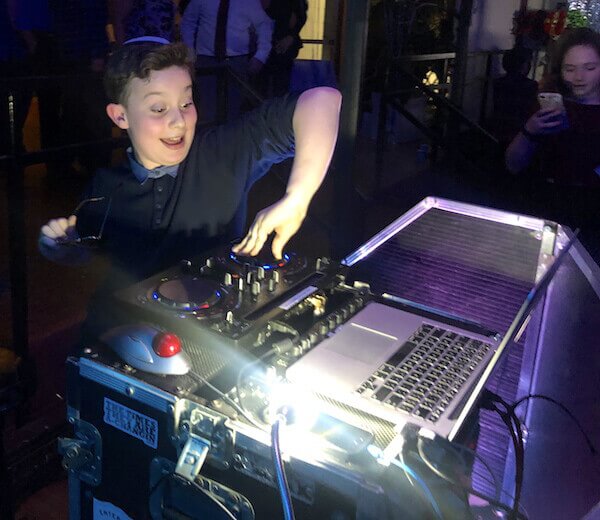 bat mitzvah guest posing as DJ