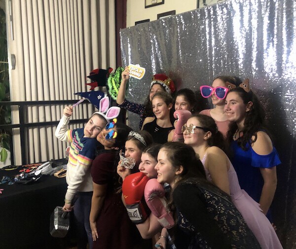 Bat Mitzvah girl and her friends pose for picture in our photo booth