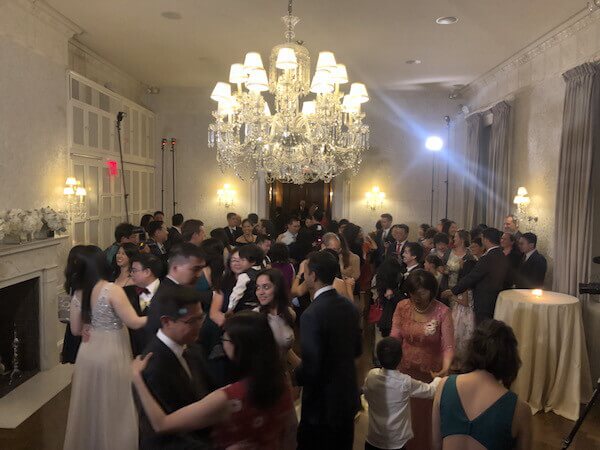 dj view of full dance floor at Harold Pratt house wedding