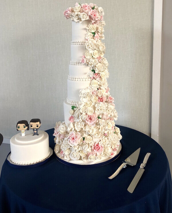 two wedding cakes at boathouse on mercer lake