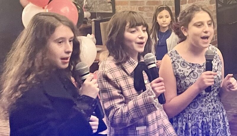 Bat Mitzvah girl and friends sing karaoke