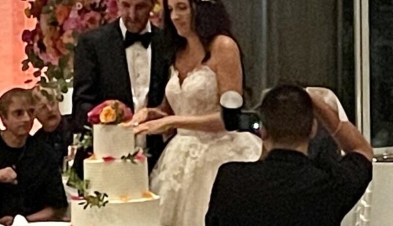 bride and groom cutting cake