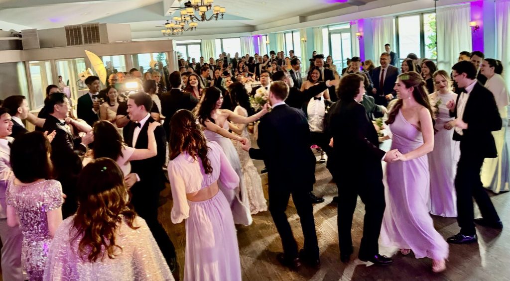 A packed dance floor at a NYC wedding reception