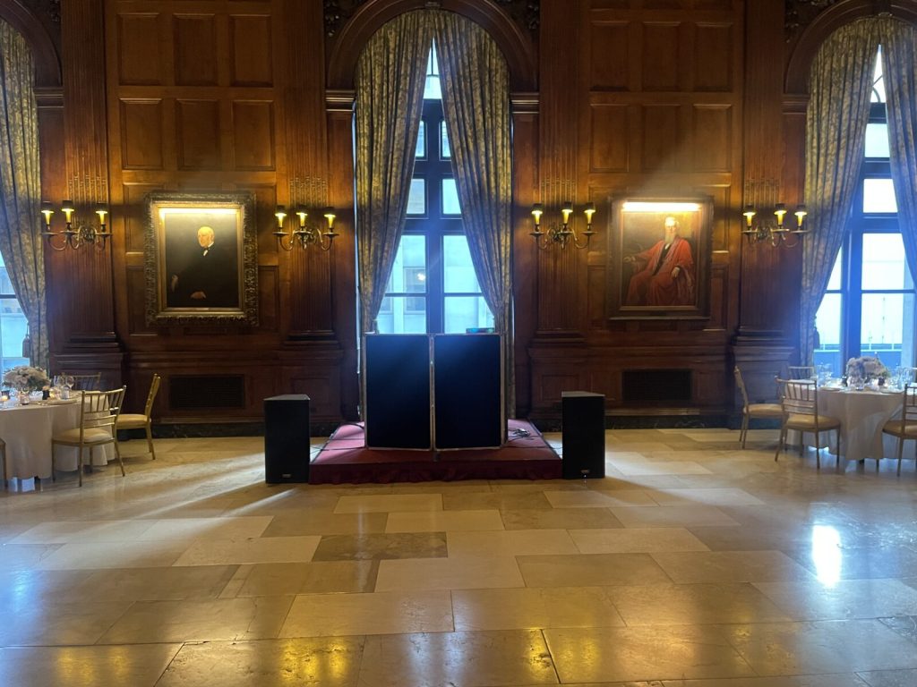 A wedding DJ booth and sound setup at a New York venue