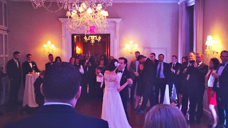 Bride and groom first dance surrounded by guests at a New York wedding