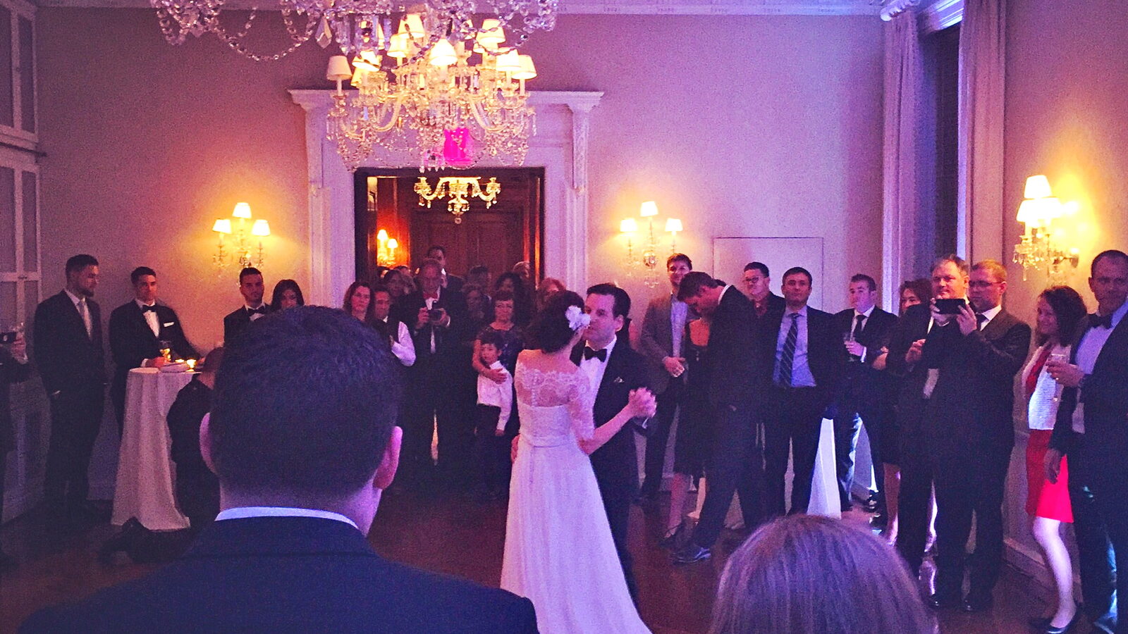 Bride and groom first dance surrounded by guests at a New York wedding