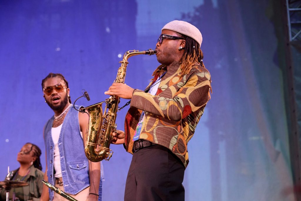 A saxophonist playing live over the DJ set at a New York event