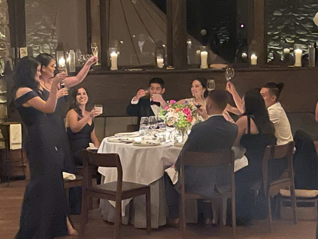 Guests raising a toast at a New York wedding reception