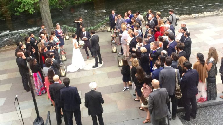 Wedding guests gathered on the patio at the New York Botanical Garden