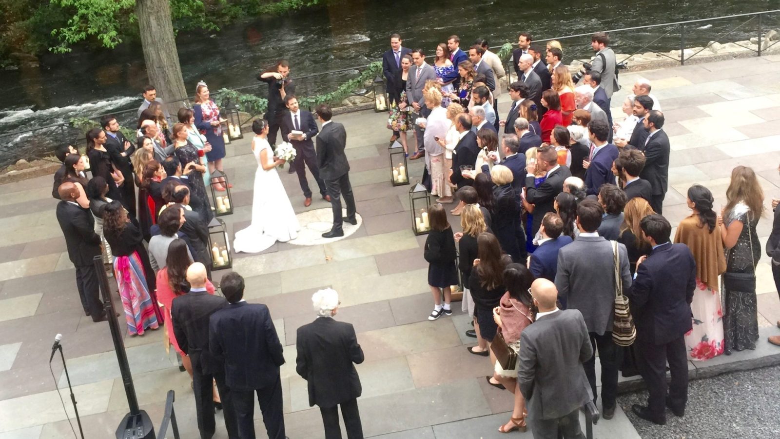 Wedding guests gathered on the patio at the New York Botanical Garden